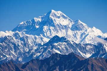 Majestic Snow-Capped Mountain Range Shimmers Against a Bright Blue Sky in the Himalayan Landscape