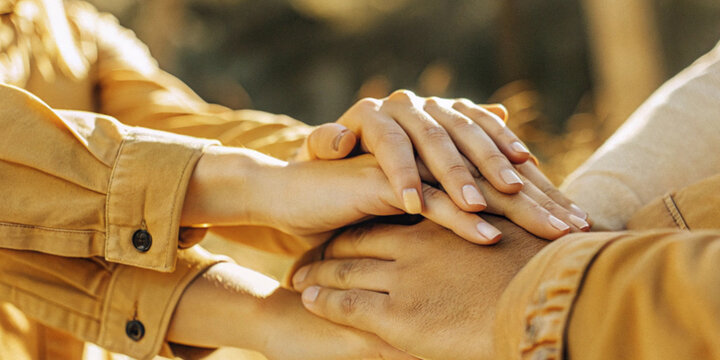 Abstract background. Multiple hands overlapping in the concept of unity in teamwork and trust in the work of good colleagues.