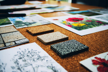 A captivating arrangement blends sketches, textured materials, and vivid flowers, creating an inspiring moodboard that evokes the beauty of a wild garden setting for designers