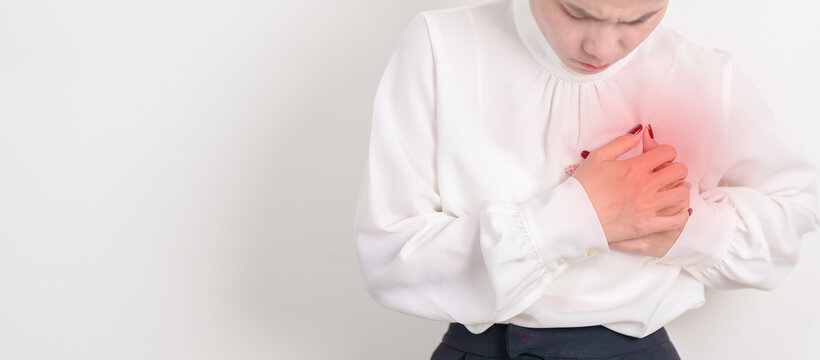 Business Woman having chest pain for Heart disease, angina disease and symptom heart attack disease Cardiovascular, Atherosclerosis, Hypertensive, Breast Cancer awareness, world Heart day and Health