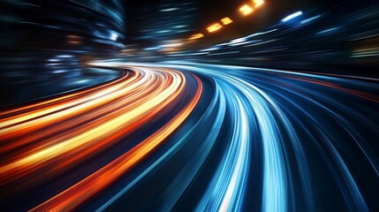 Abstract light trails of speeding vehicles on a curved road at night.