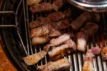 roasting pork on the charcoal grill