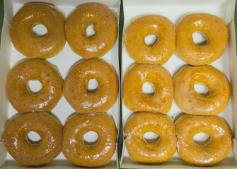 top view side view golden fresh donuts with sugar sweet glaze in box many delicious donuts
