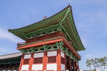 korean old pagoda with ornament, ceilings with historical drawings, large wooden columns