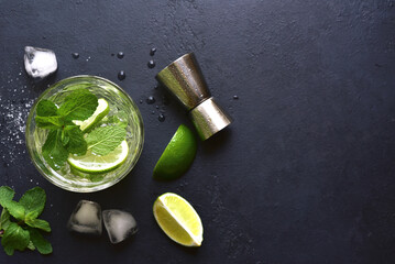 Mojito - cold summer lemonade with lime and mint .Top view with copy space.
