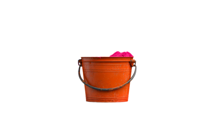 An orange bucket holds soft pink sand
