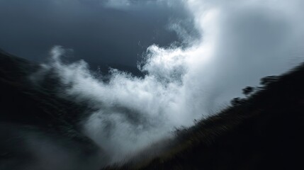 Obraz premium Misty mountain peak, dramatic clouds