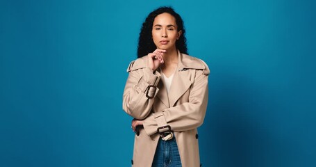 Thinking, vision and face of woman in studio for perspective, decision and brainstorming. Reflection, idea and problem solving with person on blue background space for choice, memory and mockup - Powered by Adobe