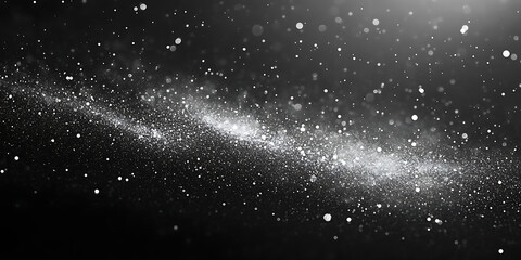 Obraz premium Shimmering stardust on a black abstract background