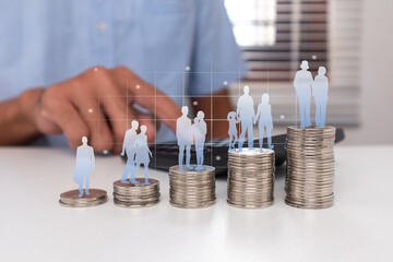 Human life cycle on stack of coins to prepare a pension fund. A man saving money for retirement...
