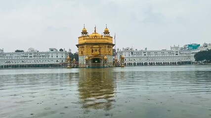Golden Temple in Amritsar, India. Majestic Sikh gurdwara covered in gold, reflecting in the sacred water pond, a spiritual and cultural landmark.