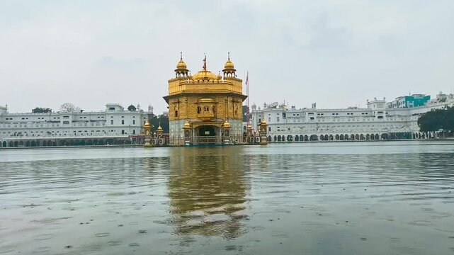 Golden Temple in Amritsar, India. Majestic Sikh gurdwara covered in gold, reflecting in the sacred water pond, a spiritual and cultural landmark.