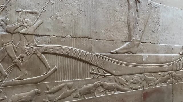 Saqqara, Egypt - Feb 5, 2024: Relief from Kagemni's mastaba in Saqqara showing men hunting hippos