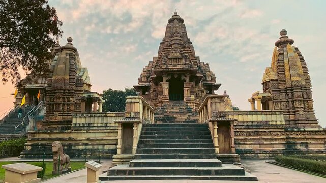 Khajuraho temples captured in a cinematic style, emphasizing their ancient elegance, intricate carvings, and spiritual atmosphere for dramatic visual storytelling.