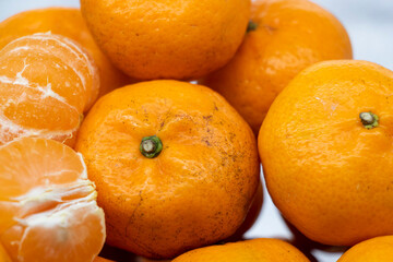 Ripe Orange or Citrus or tangerina and peeled fruit