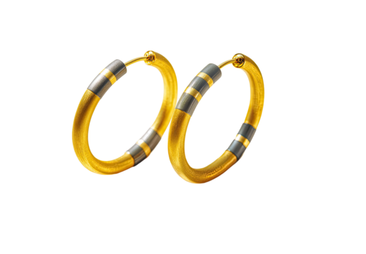 Gold hoop earrings with dark gray stripes.  Two circular hoops, gold-colored, with two bands of dark gray/black.  Simple, elegant design.  Clip-on style