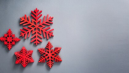 Wooden red snowflake decorations on gray background with copy space. Generated image
