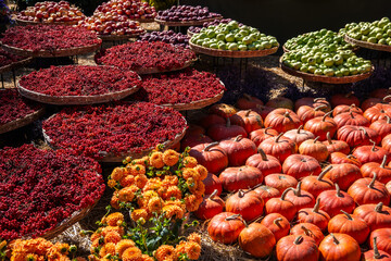 A cornucopia of pumpkins, berries, and apples. Baskets showcase autumnal bounty, like the wild Georgian apples traditionally harvested for winter.