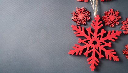 Wooden red snowflake decorations on gray background with copy space. Generated image