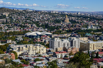 A bird's eye captures Tbilisi's sprawl, showcasing its blend of historic structures alongside...