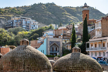 Brick domes cover ancient sulfur baths, a vital part of Tbilisis history. Seen against Orbeliani...