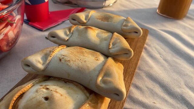 Fiestas Patrias chile grill parrilla meat chorizo table empanadas chimichurri