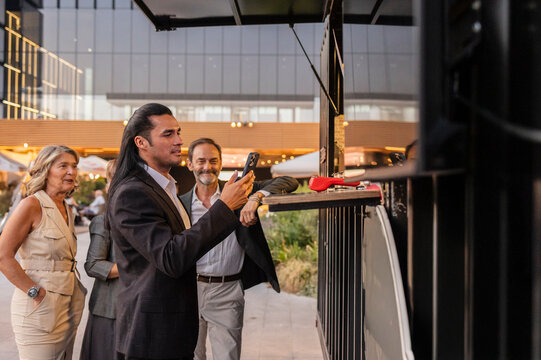 Business professionals ordering at outdoor food truck