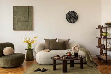 Warm and modern living room with soft neutral seating, mock up wall art, green and yellow accents and organic decor.  © FollowTheFlow