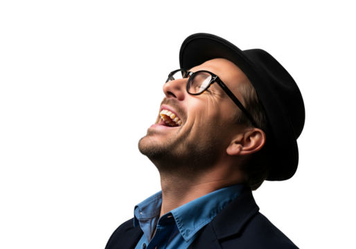 PNG cut out isolated background. A close-up portrait of a happy and stylish young man wearing a fedora hat and glasses. He is looking up and laughing with a joyful, authentic expression.

