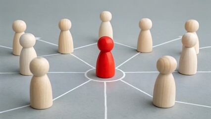 Obraz premium Central Leadership Concept – Red Wooden Figurine in Middle of Connected Network Circle on Blue Background