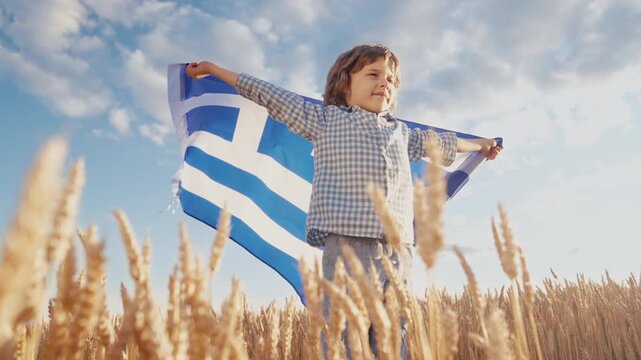Patriot Boy Standing Wheat Field Holding Greek Hellas Flag in the Wind, Homeland