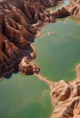 Aerial View of Turquoise Lakes Winding Through Arid Desert Canyons