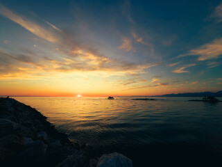 Rocks Of The Cliff Facing The Beautiful Sunset 