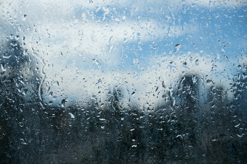 Rain drops on a London balcony glass. 