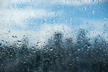 Rain drops on a London balcony glass. 