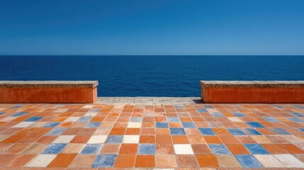 Obraz premium Terracotta tiled walkway overlooking the vast ocean.