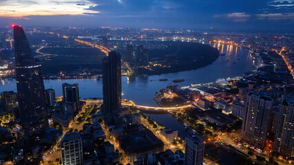Aerial view of early morning in Ho Chi Minh City, Vietnam with development buildings, transportation, energy power infrastructure. Financial and business centers