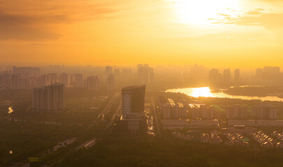 Aerial view of early morning in Ho Chi Minh City, Vietnam with development buildings, transportation, energy power infrastructure. Financial and business centers