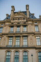 The facade of a historic building in the center of Paris in Romanesque style