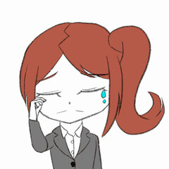 涙を流すスーツを着た女性