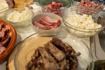 Raw pork ribs and vegetables prepped for a traditional recipe. Fresh ingredients.
