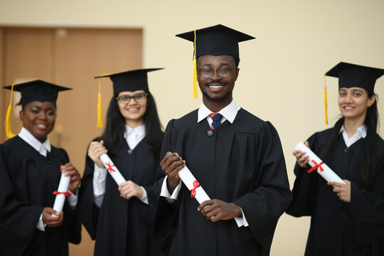 Group, students and diversity at college graduation, happiness for degree or diploma certificate. Team, graduates and celebrating for academic achievement at university campus, smile for knowledge