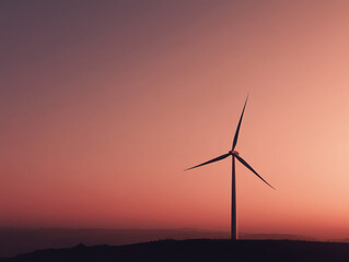 Wind turbine generating clean energy at sunset in rural landscape