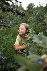 a funny girl is sitting down and making funny faces