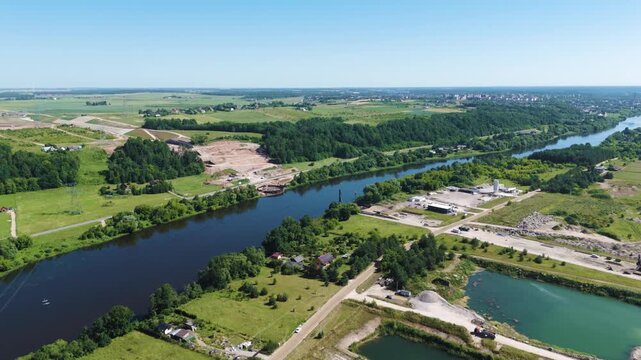 Massive construction site of Rail Baltica bridge over Neris river, aerial view