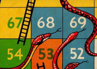 Detail from a vintage snakes and ladders game board.