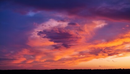 vibrant sunset sky with orange and purple cloudscape pastel hues at dawn or dusk