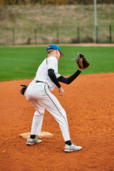 Dynamic teenage boy showcasing skills on the baseball field during practice