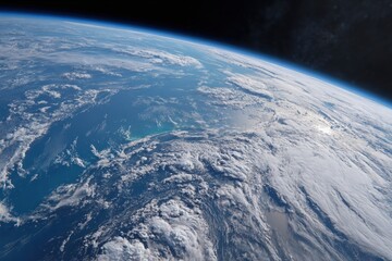 Obraz premium Panoramic view of Earth from orbit displaying vast oceans swirling clouds and the planet's curvature
