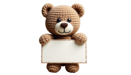 Adorable handmade crochet bear holding a blank sign in a bright, cheerful setting with soft colors and playful vibes